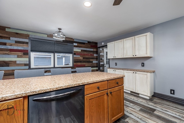 kitchen with dark wood finished floors, dishwasher, baseboards, and recessed lighting