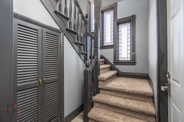 stairway featuring baseboards