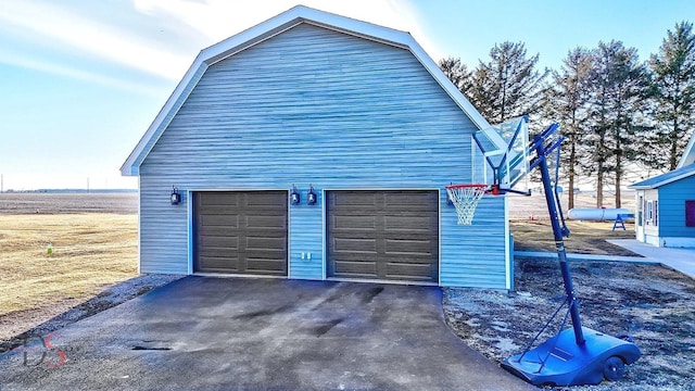 garage featuring aphalt driveway