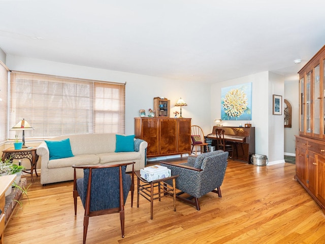 living room featuring light wood-style flooring and baseboards