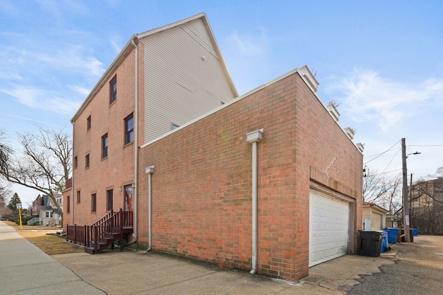 view of side of property with brick siding