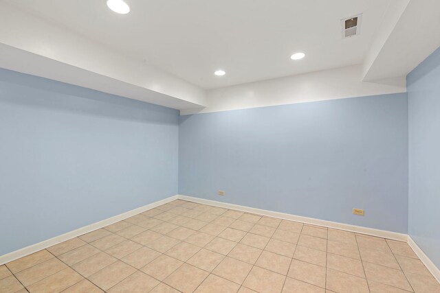 finished basement with recessed lighting, visible vents, and baseboards