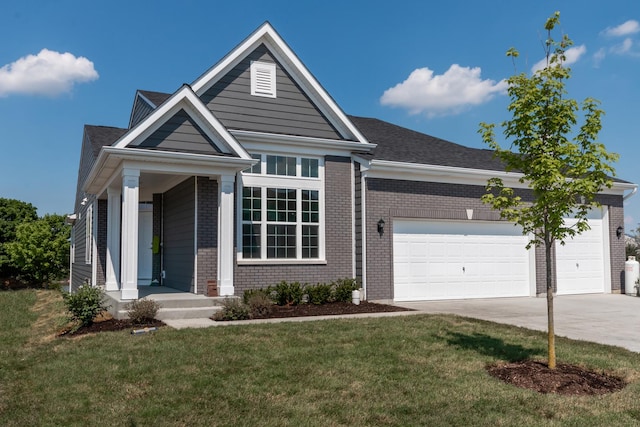 view of front of property with concrete driveway, brick siding, a front lawn, and an attached garage