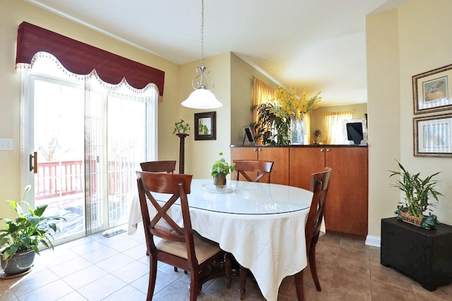 dining room with visible vents and light tile patterned floors