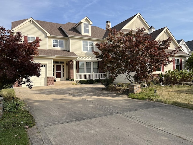 view of front of home featuring a garage, brick siding, driveway, and a shingled roof