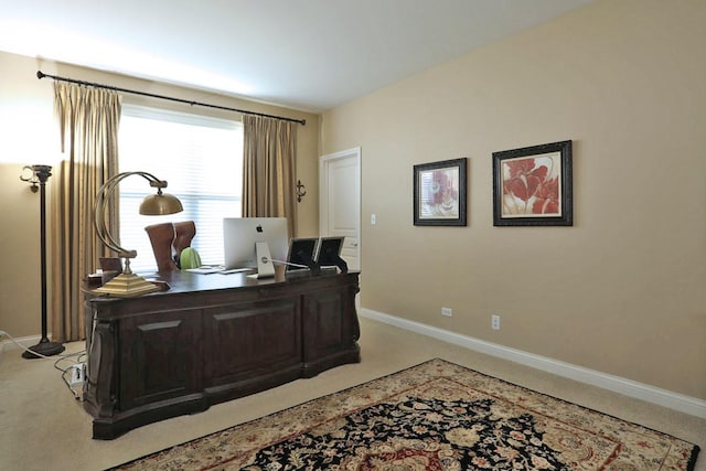 office space with light carpet and baseboards