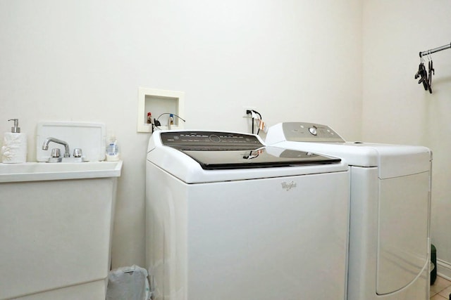 clothes washing area featuring laundry area and washing machine and dryer