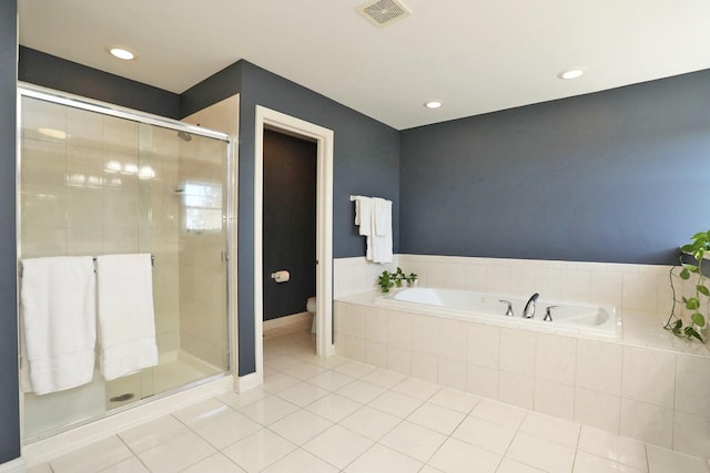 full bathroom with toilet, visible vents, a shower stall, a bath, and tile patterned floors