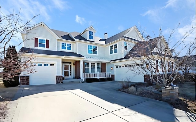 view of front of house featuring brick siding, driveway, and an attached garage