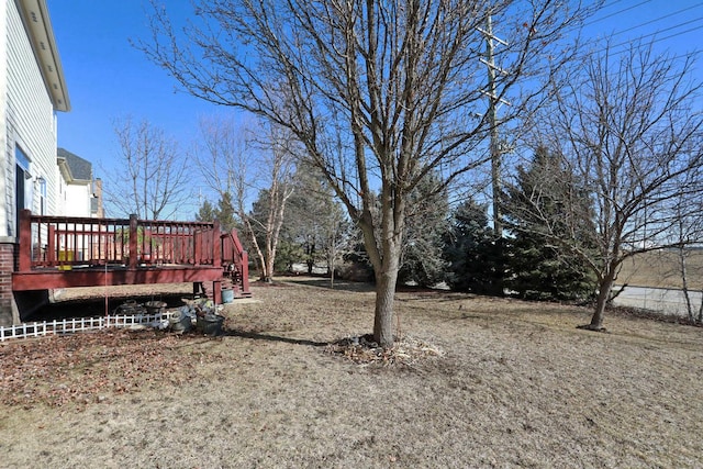 view of yard with a wooden deck