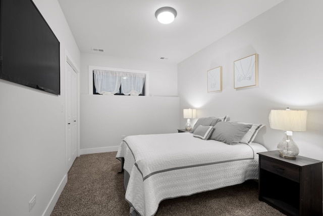 carpeted bedroom with baseboards and visible vents