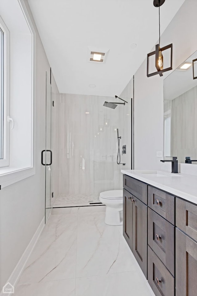 bathroom featuring visible vents, toilet, marble finish floor, vanity, and a shower stall