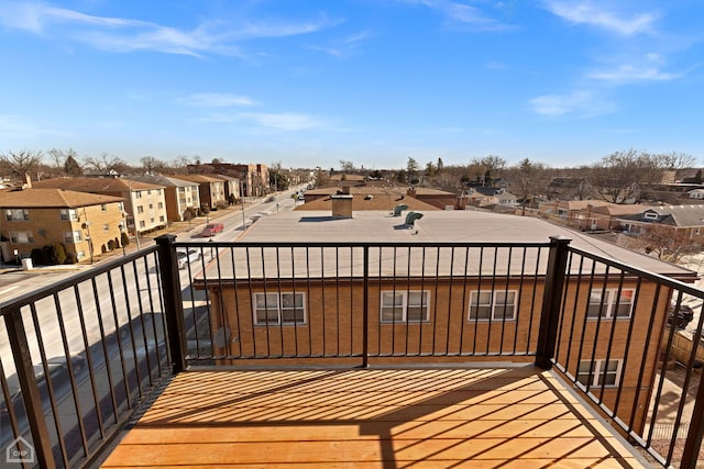 wooden deck with a residential view