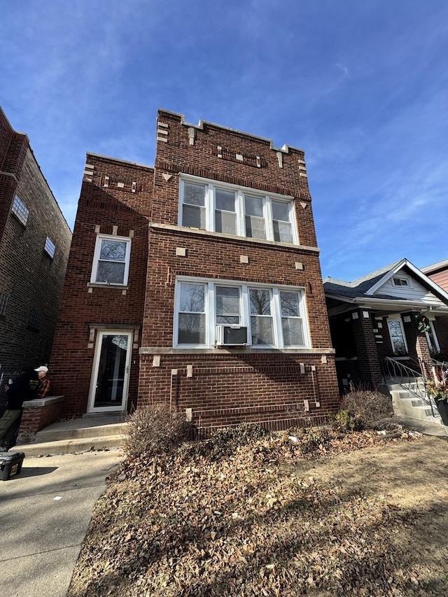 view of front of home featuring brick siding