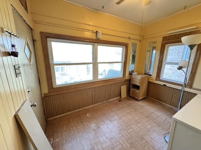 unfurnished sunroom with a healthy amount of sunlight