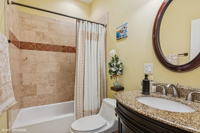 full bath featuring toilet, shower / bath combo with shower curtain, and vanity