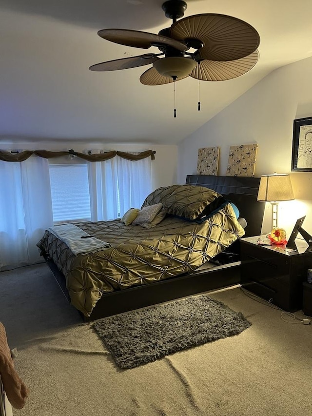 bedroom featuring lofted ceiling, carpet, and ceiling fan