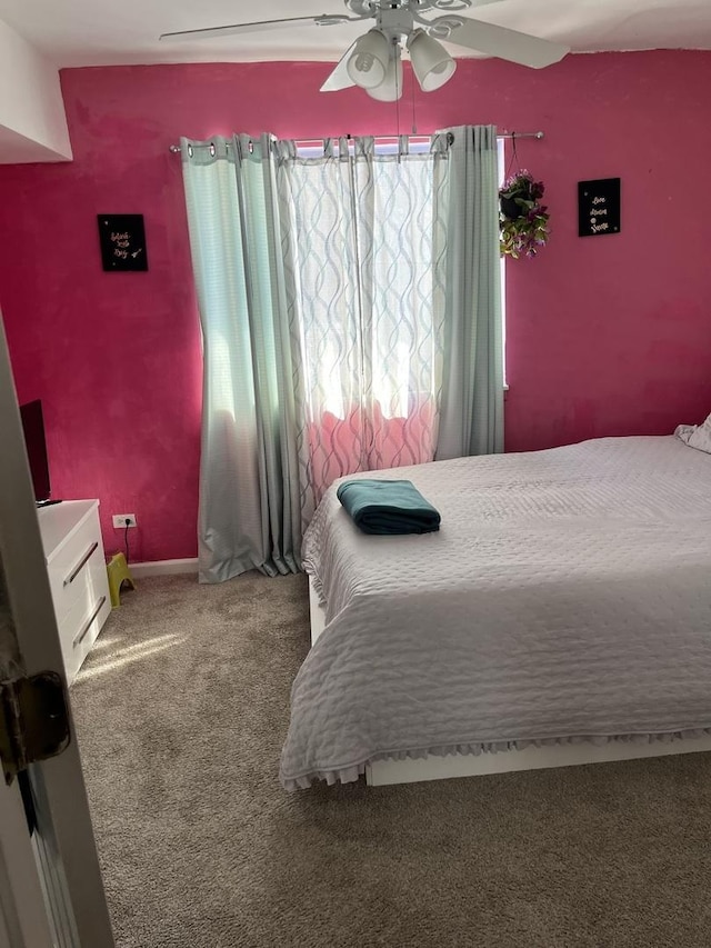 bedroom featuring carpet and a ceiling fan