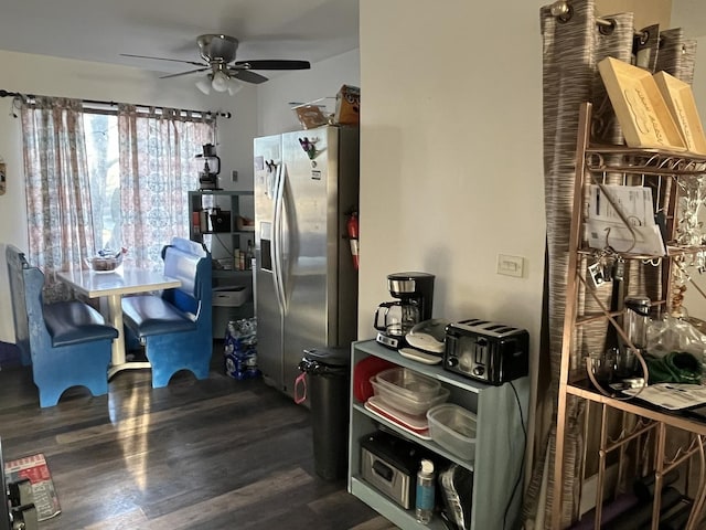 kitchen featuring a ceiling fan, dark wood-style flooring, and stainless steel fridge