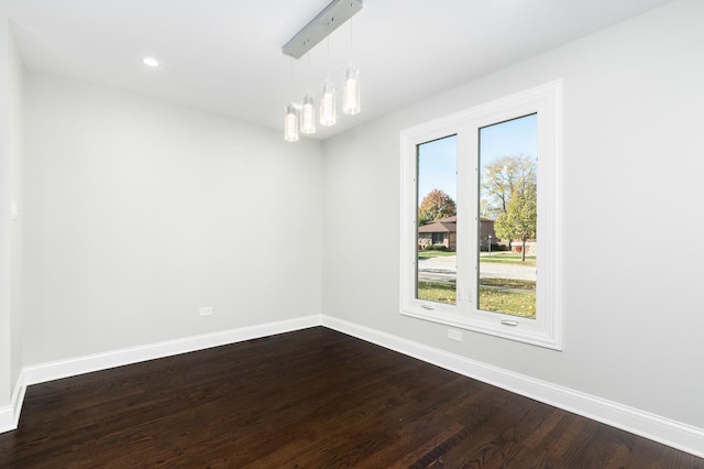 unfurnished room featuring baseboards, dark wood-style flooring, and recessed lighting