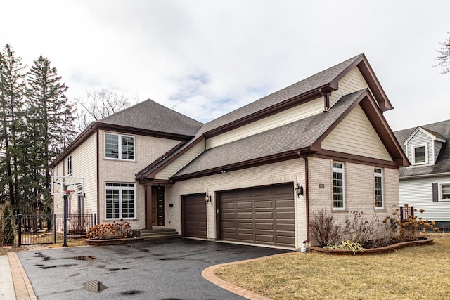 view of front of property featuring driveway, brick siding, roof with shingles, and an attached garage