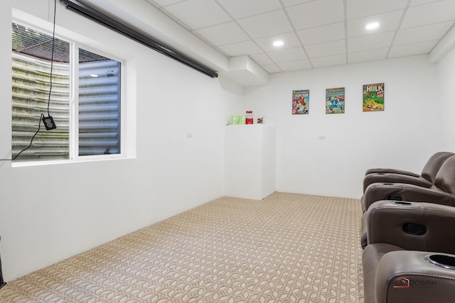 interior space featuring carpet floors, recessed lighting, and a drop ceiling