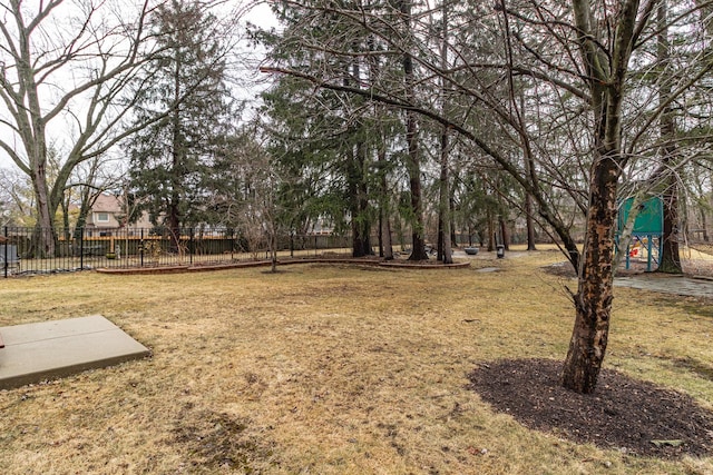 view of yard with fence and playground community