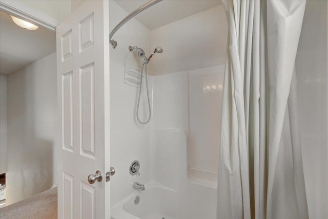 bathroom with shower / bath combination with curtain