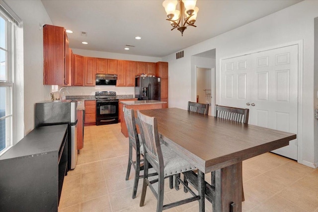 dining room with recessed lighting, visible vents, and a chandelier