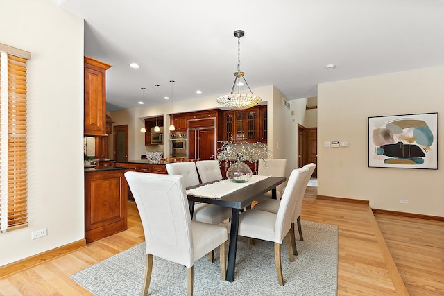 dining space with baseboards, recessed lighting, visible vents, and light wood-style floors