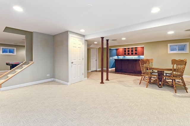 interior space with light carpet, baseboards, and recessed lighting