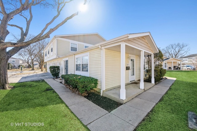 view of side of home with a lawn