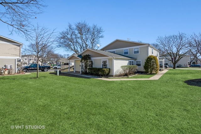 view of side of property with a yard