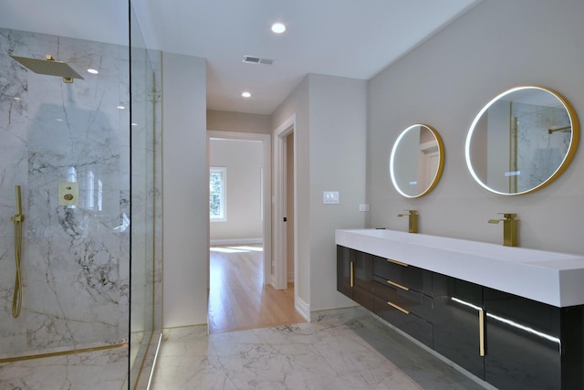 full bath with recessed lighting, visible vents, marble finish floor, a marble finish shower, and double vanity