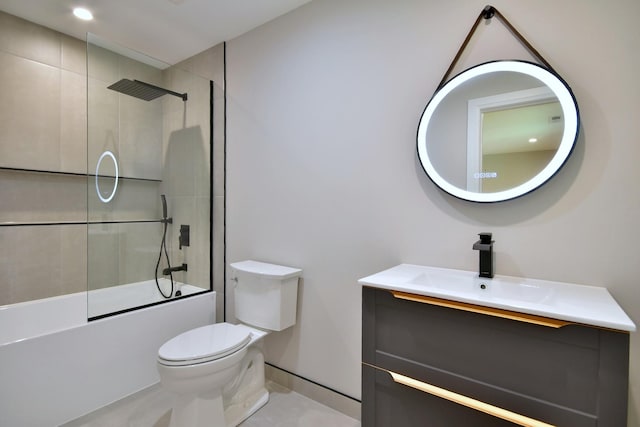 full bathroom featuring toilet, baseboards, tub / shower combination, and vanity