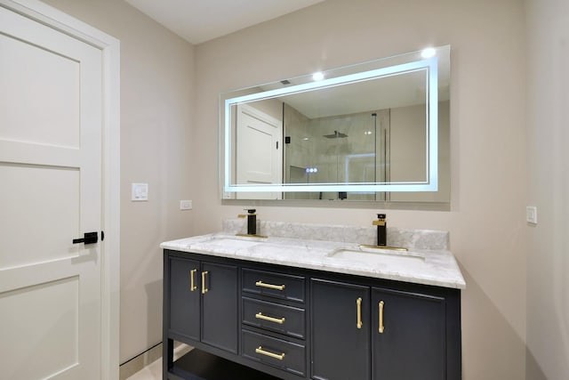 bathroom featuring double vanity, walk in shower, and a sink