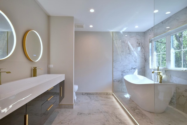 bathroom with visible vents, toilet, a soaking tub, marble finish floor, and recessed lighting