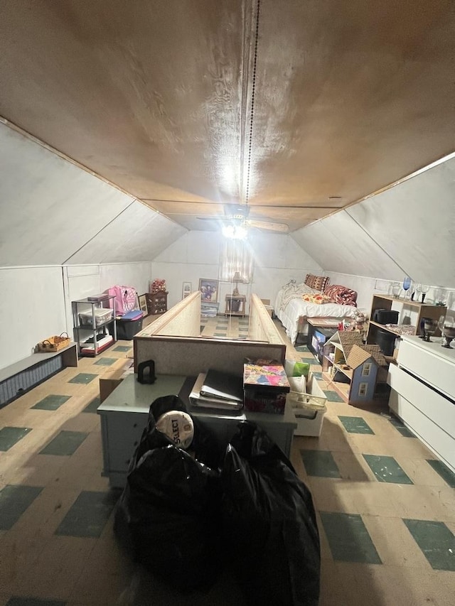 additional living space featuring lofted ceiling and tile patterned floors