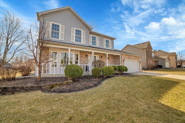 view of front facade featuring a front yard, driveway, an attached garage, covered porch, and brick siding