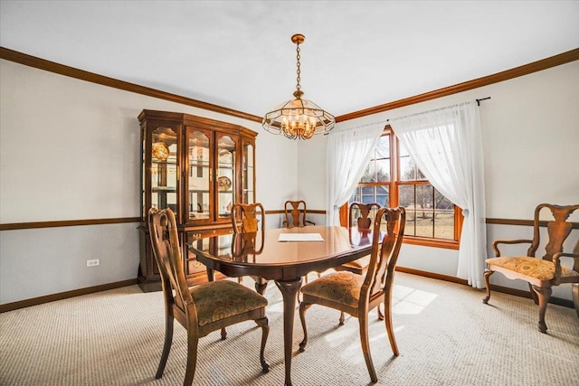 dining room featuring light carpet, a notable chandelier, and baseboards