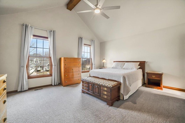 bedroom with beamed ceiling, baseboards, visible vents, and light carpet