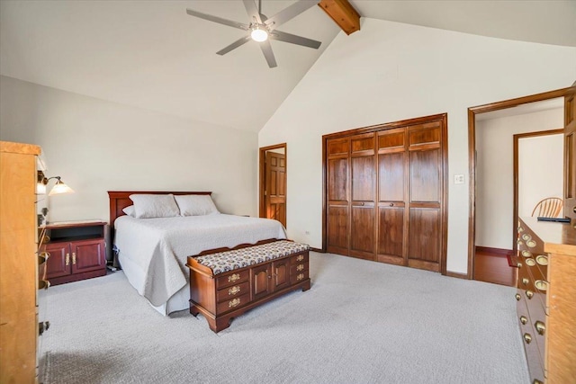 carpeted bedroom featuring ceiling fan, beam ceiling, baseboards, and high vaulted ceiling