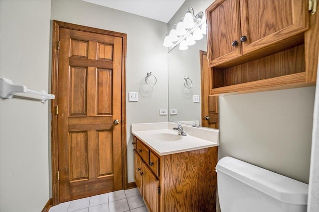 bathroom with vanity, tile patterned floors, and toilet