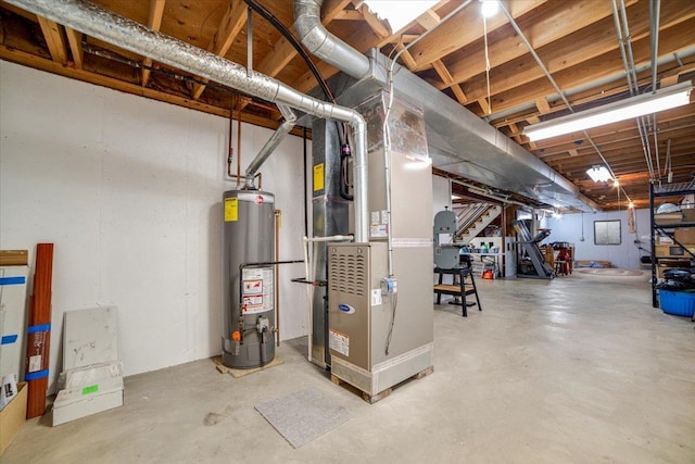 unfinished basement featuring heating unit and gas water heater