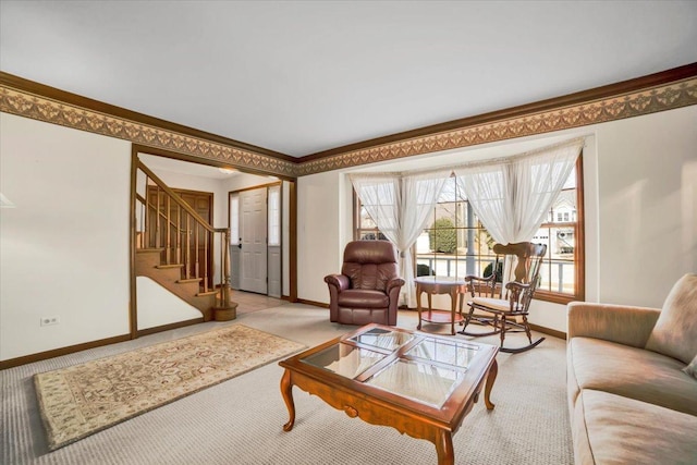 living room with stairway, ornamental molding, baseboards, and light carpet