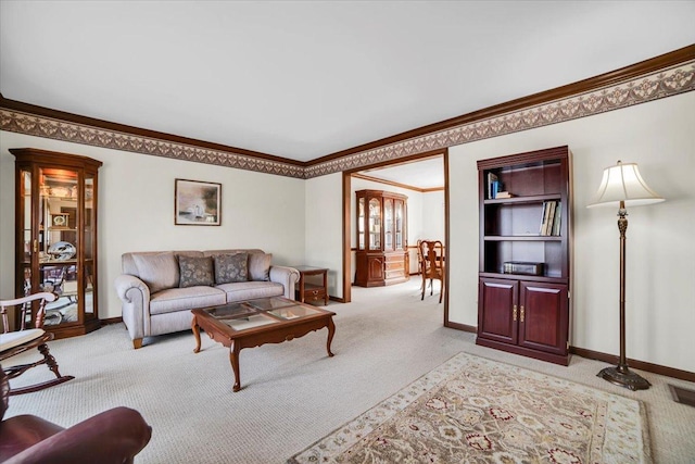 living area featuring light colored carpet, crown molding, and baseboards