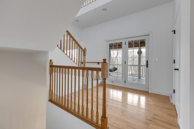 entrance foyer with recessed lighting, light wood-style flooring, and baseboards