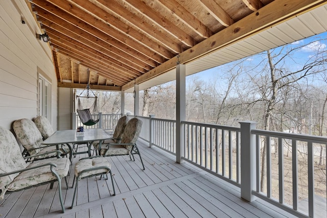 wooden deck with outdoor dining space