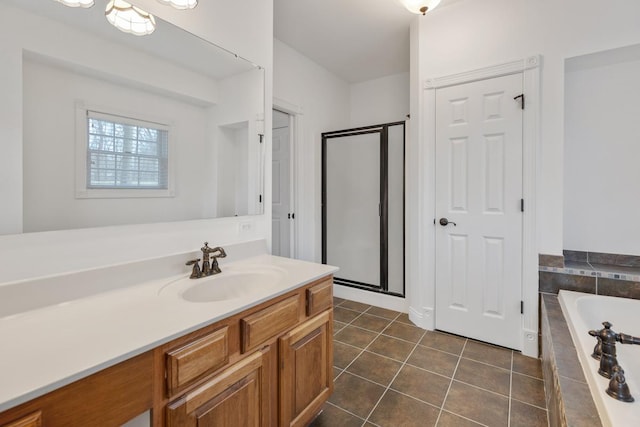 full bath with a garden tub, a shower stall, vanity, and tile patterned floors