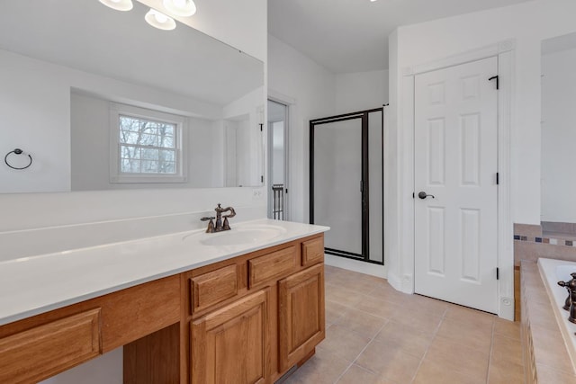 full bath with vanity, a shower stall, a bath, and tile patterned floors